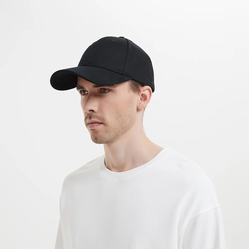 Side view of a man wearing the black SecureShield EMF Blocking Baseball Cap.