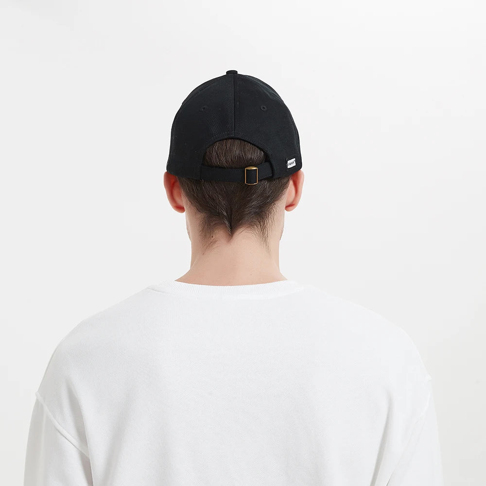 Back view of a male wearing the SecureShield EMF Blocking Baseball Cap, highlighting its classic design and fit while suggesting protection against electromagnetic fields.